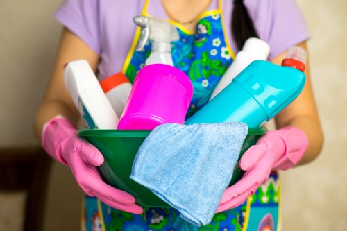 Professional deep cleaner scrubbing a kitchen surface